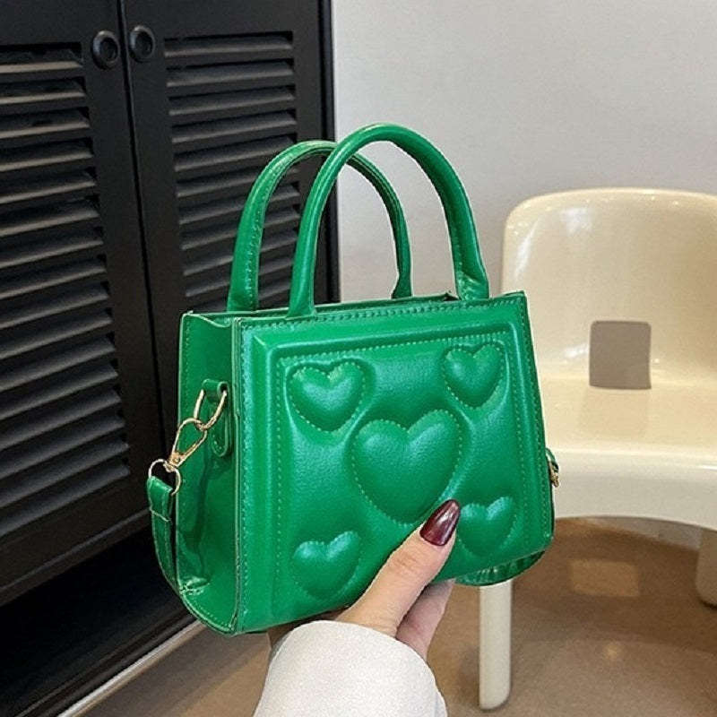 1pc Women’s Stylish Solid Color Handbag with Detachable Strap – Heart Pattern Design, Perfect for Valentine’s Day Gift, Available in Magenta, White, Black, Green, Yellow